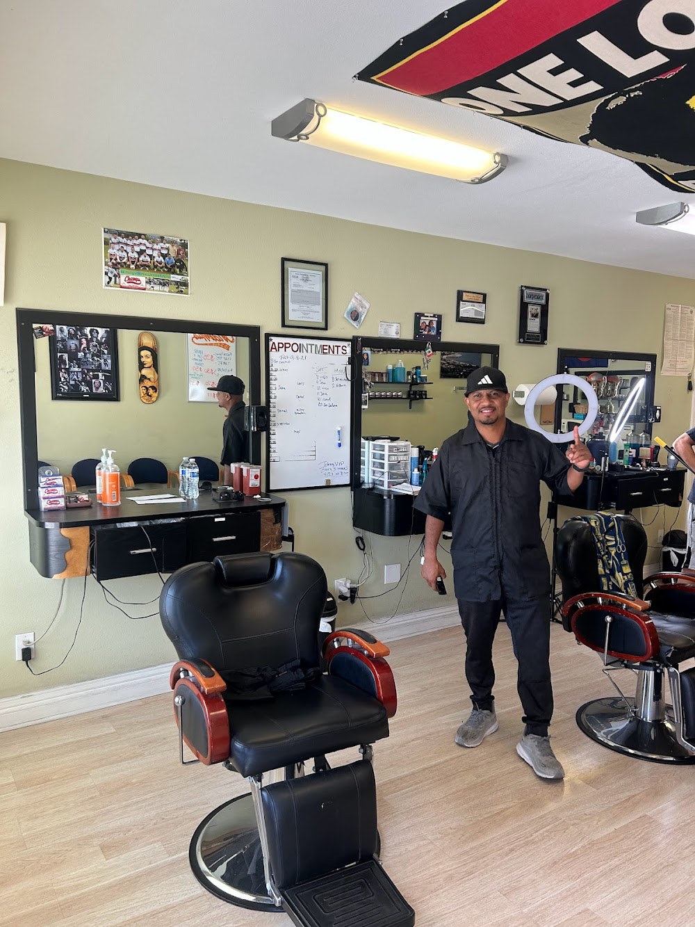 Champ's Barber Shop owner Resendiz providing expert grooming services in downtown Santa Barbara